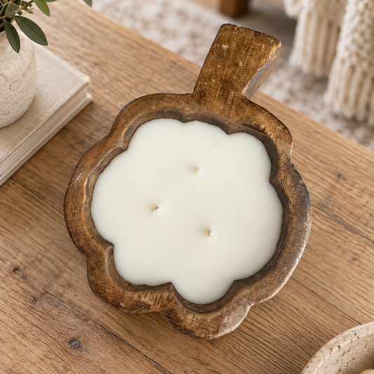 Wooden pumpkin dough bowl filled with candle